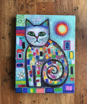 Quirky, colourful , seated cat .