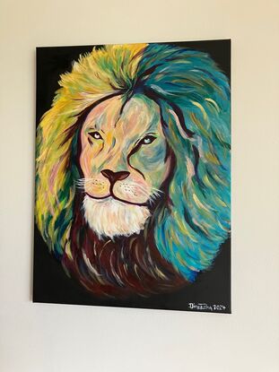 The head of a Lion with a quiet gaze of inner strength. Depicting loyalty, strength and resilience. Vibrant colours used for the free flowing mane. Black background.