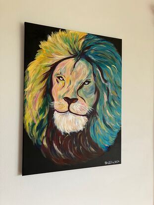 The head of a Lion with a quiet gaze of inner strength. Depicting loyalty, strength and resilience. Vibrant colours used for the free flowing mane. Black background.