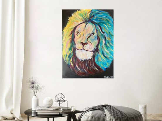 The head of a Lion with a quiet gaze of inner strength. Depicting loyalty, strength and resilience. Vibrant colours used for the free flowing mane. Black background.