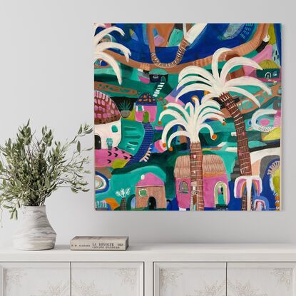 Vibrant abstract artwork depicting a village, river, palm trees and colorful buildings. 