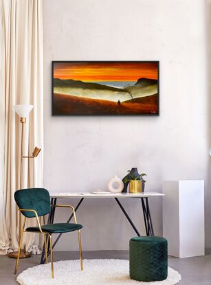 Man meditating on mountain and ocean views in sunset 