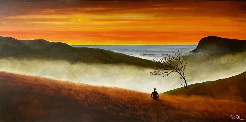 Man meditating on mountain and ocean views in sunset 