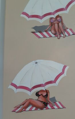 Women on beach sand under pink and white umbrellas