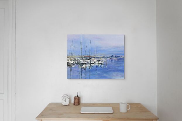 A landscape oil painting of boats at Williamstown in Melbourne, Victoria. The water and sky are blue and the boats are white. Their masts are reflected in the water. The city can be seen in the background.