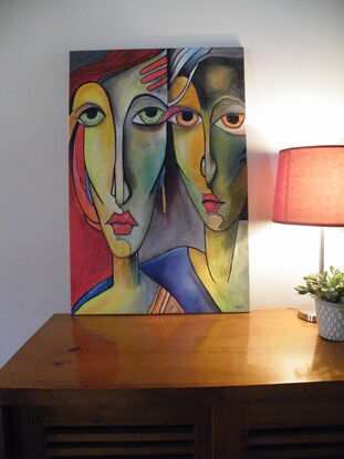 a  very colorful painting showing two abstract pop art style sisters maybe from the play Cinderella. 