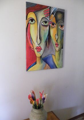 a  very colorful painting showing two abstract pop art style sisters maybe from the play Cinderella. 