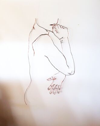 A wire sculpture. Single line drawing of a nude female looking over her shoulder