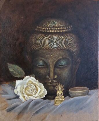 A still life painting of a large Buddha head statue in a dark bronze and green, with a miniature seated golden brass Buddha in the foreground. On the sides lay a white rose and a bronze singing bowl.