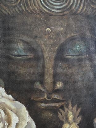 A still life painting of a large Buddha head statue in a dark bronze and green, with a miniature seated golden brass Buddha in the foreground. On the sides lay a white rose and a bronze singing bowl.