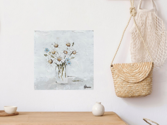 Still Life painting of daisies and forget-me-nots in glass  vase.
