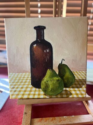 Antique bottle, pears on gingham tablecloth