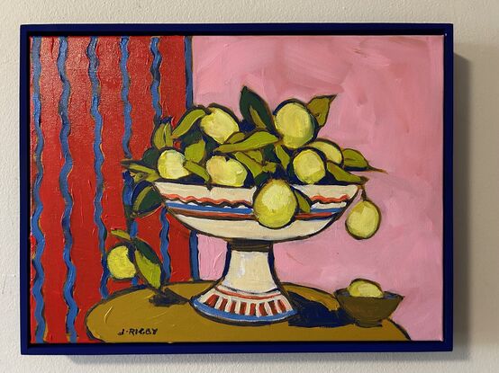 a modernist still life with bright red and pink background. A white pedestal bowl of lemons sits on a rounded brown table