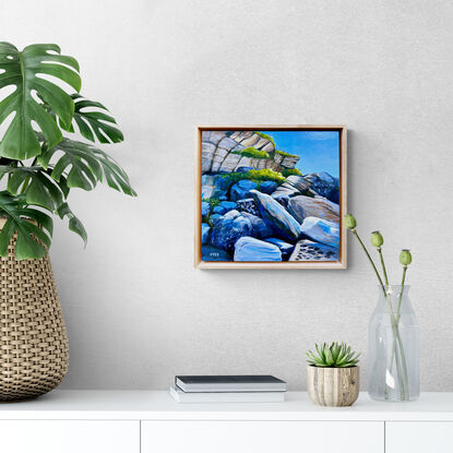 Seaside rocks and plants with blue sky