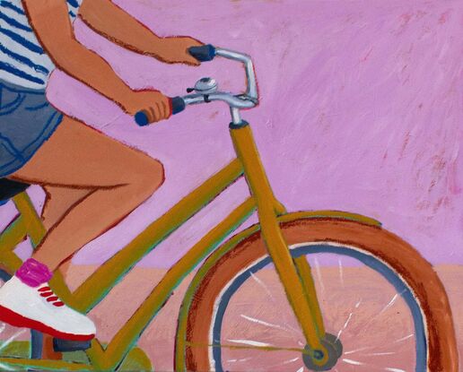 A crop of a woman riding a bike, wearing navy shorts, white shoes, pink socks and a blue and white striped t'shirt. Her shoulders and head are cropped out of the artwork. The vintage looking bike is a chartreuse colour with ochre tires, the background is a classic pink, the ground a pale peach. The artwork sits in a white floating frame.