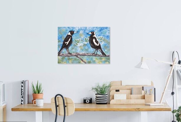 Two magpies sitting on a tree branch.