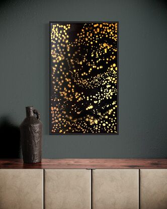 A black canvass with clusters of shimmering gold stars in an abstract impressionist style