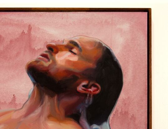 
This artwork by Tom Gibbs portrays a man immersed in water, with his head tilted back and eyes closed in a moment of serene introspection. The background is a soft, warm pink with subtle variations, enhancing the sense of tranquility and contrast with the cooler tones of the water. The man's skin is illuminated with warm and cool highlights, capturing the play of light on his wet skin. The water around him swirls gently, creating a dynamic interaction between the figure and his surroundings. The painting evokes themes of peace, relaxation, and the soothing embrace of water, beautifully blending elements of warmth and coolness.