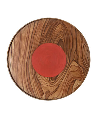 wooden circle with red small circle in the middle