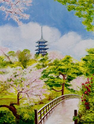 Pink blossoms in a garden with pagoda in Japan.