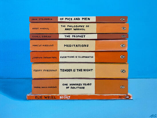 A pile of orange toned books on a blue background.