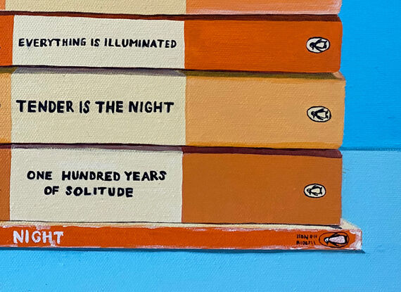 A pile of orange toned books on a blue background.