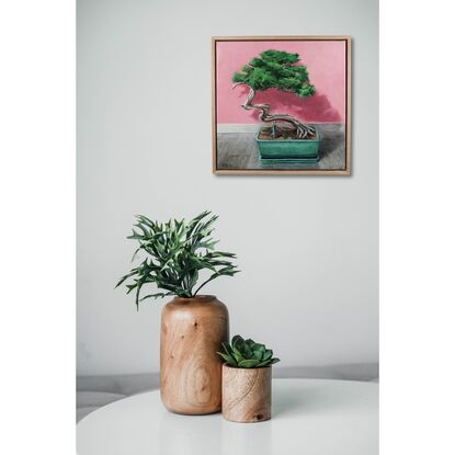 Still life painting of bonsai tree, with a small man in the pot raking up the leaves