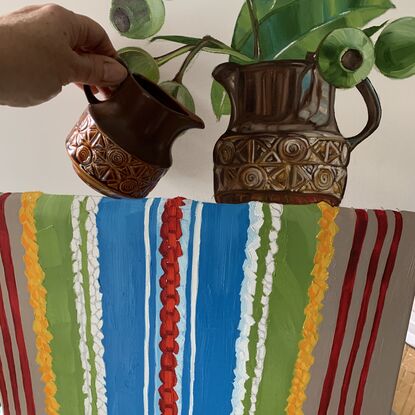 Local gum nuts in a Vintage Beswick creamer jug
Placed on top of an original 1970's striped bedspread 


