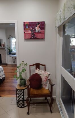 Woman reclining on a lounge drinking rose wine