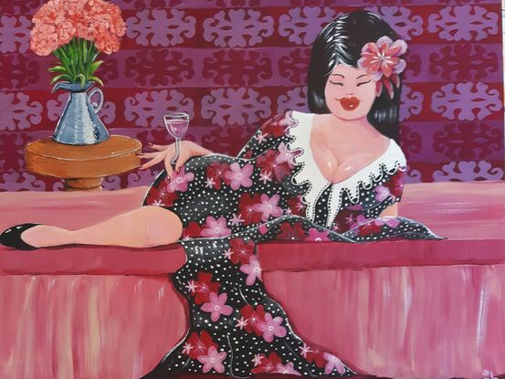 Woman reclining on a lounge drinking rose wine