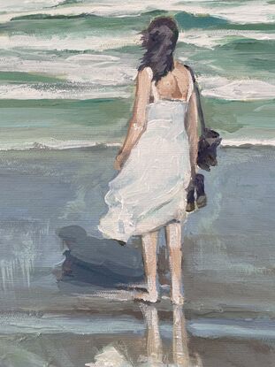 Girl in white dress stormy day at beach