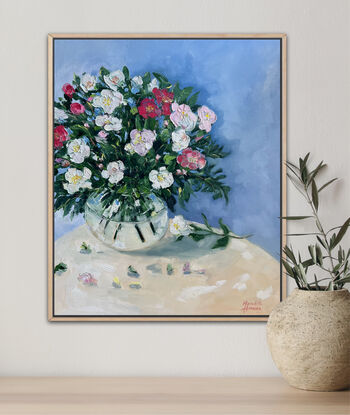 Pink and white Camellias in glass vase.