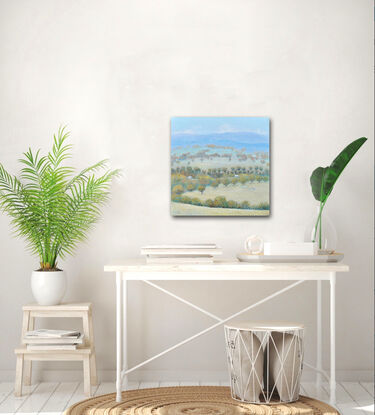 A painting of an Australian country landscape with distant rolling hills, gum trees, farm houses and grazing sheep.