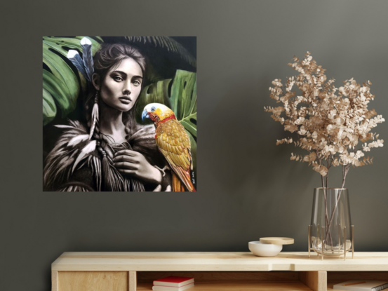 Portrait of a beautiful strong  Maori woman who is a guardian of the forest with a large parrot perched in her hands.