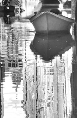 Inviting reflection on canal in Venice, Italy