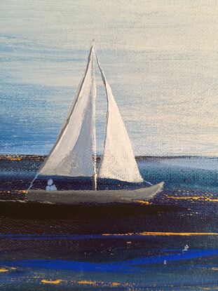 Two sailing boats returning to shore in fading light