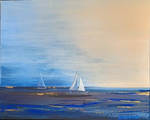 Two sailing boats returning to shore in fading light