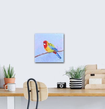 Textured oil painting of a native Australian bird, the Eastern Rosella parrot. Its face is red with a white spot on the cheek. The chest and back are bright yellow and lime green. The wings and tail feathers are blue.