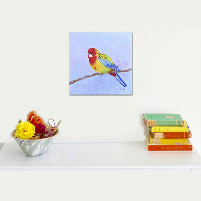 Textured oil painting of a native Australian bird, the Eastern Rosella parrot. Its face is red with a white spot on the cheek. The chest and back are bright yellow and lime green. The wings and tail feathers are blue.