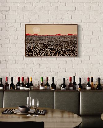 A desert lanscape, leopard print foreground mimics the dry cracked desert eath, and the mountains are a lipstick red against a cream-coloured sky.