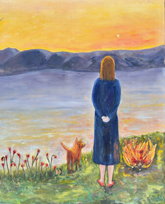 A woman and her animal companion look across water to the mountains and evening sky