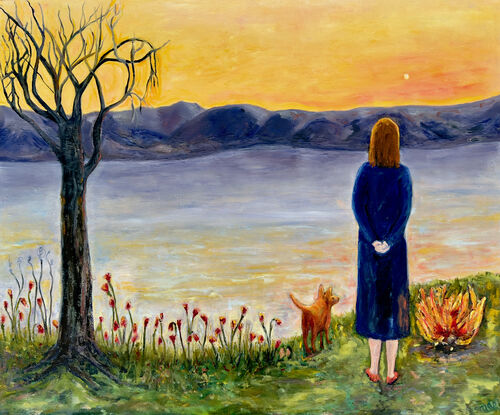 A woman and her animal companion look across water to the mountains and evening sky