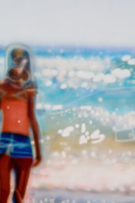 ABSTRACT impressionism of people on a warm sunny beach. the painting is blurred as one's eyes typically see long distance... however the figures and beach are clearly the subject of the painting