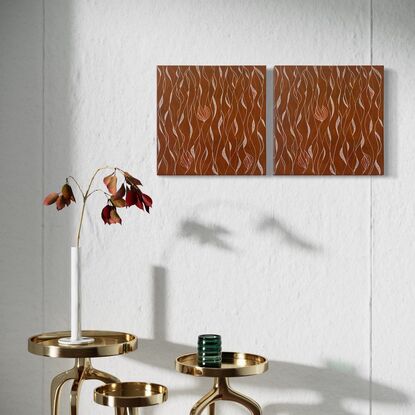 Loose patterns of white and bronze set against a background of earthy orange/red.