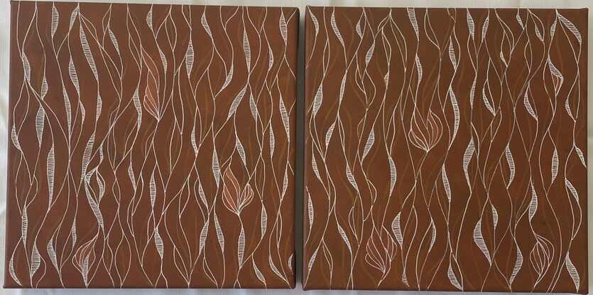 Loose patterns of white and bronze set against a background of earthy orange/red.