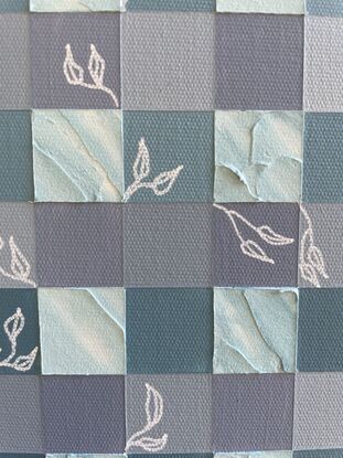 A grid of blues and whites, with textured modelling paste used to create depth and movement, with white floral details as highlights.