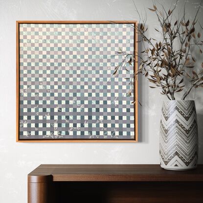 A grid of blues and whites, with textured modelling paste used to create depth and movement, with white floral details as highlights.