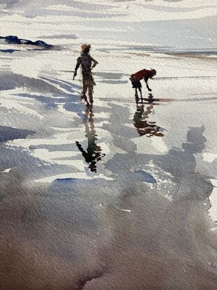 A cloudy day casts reflections on wet sand on Wye River beach