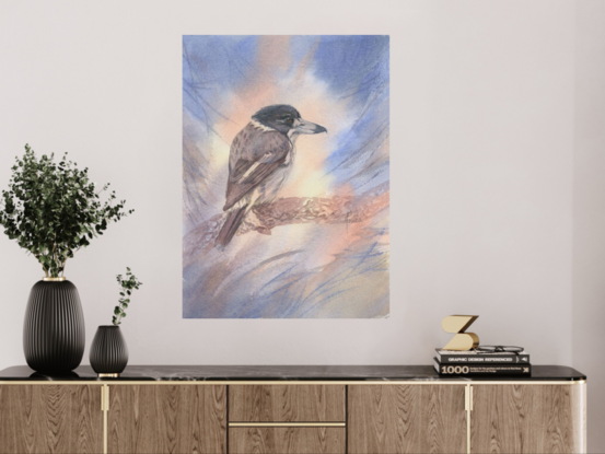 Grey Butcherbird perched on a textured branch with an abstract background