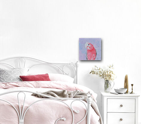 A textured portrait painting of a pink, grey and white galah cockatoo is depicted against a soft lavender background.